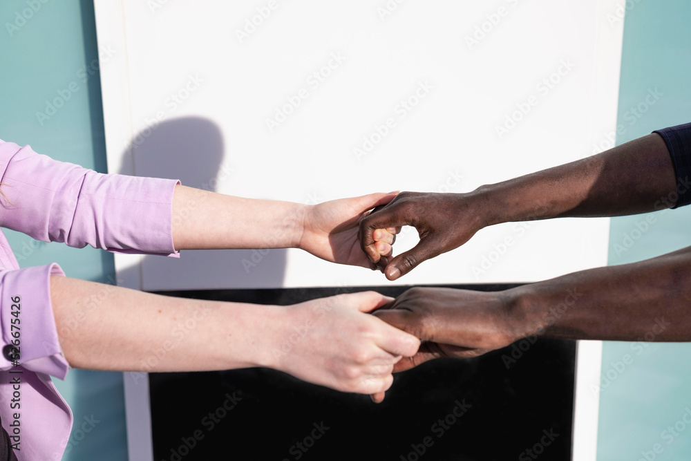 Couple holding hands on sunny day Couple holding hands on sunny day