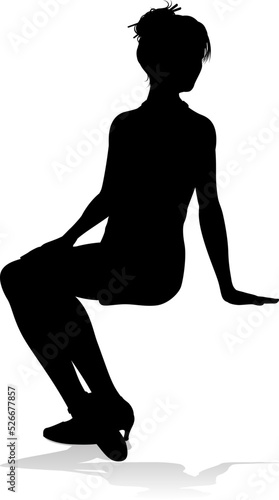 A silhouette woman seated wearing a dress photo