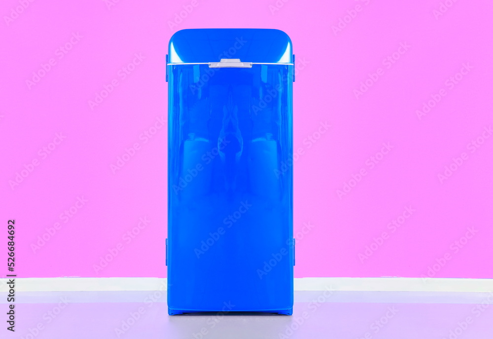 blue refrigerator with pink wall background blue refrigerator with pink wall background