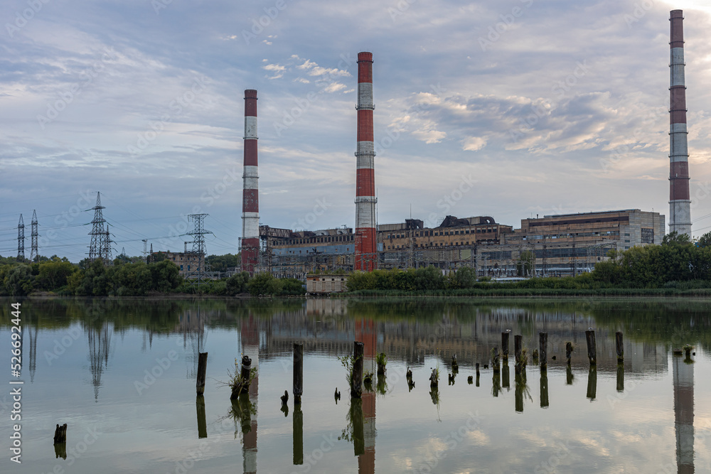 old factory stands near the lake