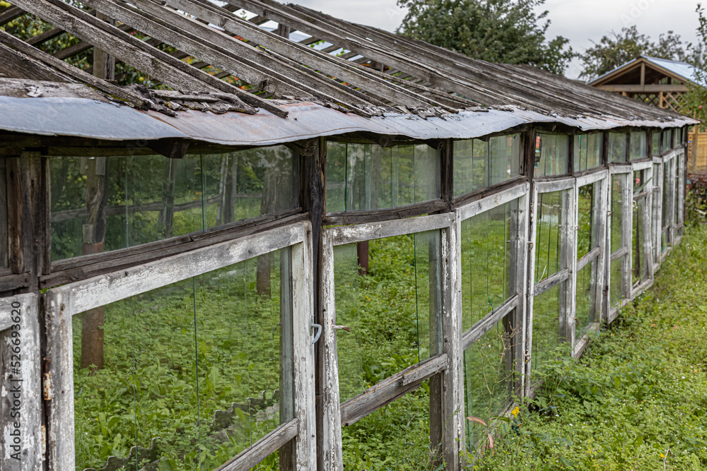 old abandoned greenhouse stands in the garden old abandoned greenhouse stands in the garden