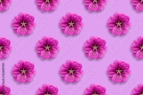 Pattern of purple flowers on a purple background © Ignat