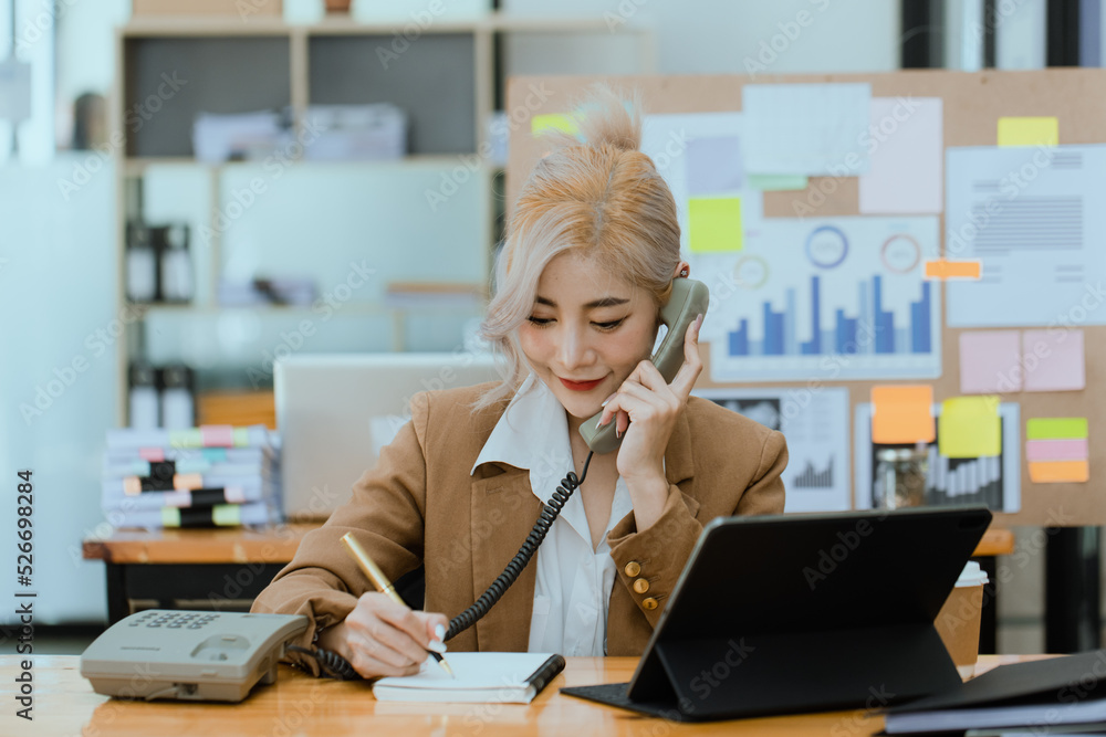 Businesswoman working with calculator and laptop computer at office workplace, finance marketing chart, Business digital technology and marketing concept. Businesswoman working with calculator and laptop computer at office workplace, finance marketing chart, Business digital technology and marketing concept.