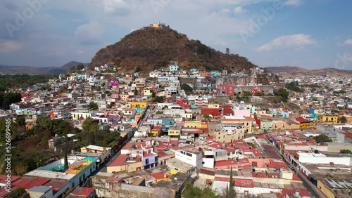 Drone footage of Atlixco city. shows the colorful houses and the famous church on the top of San Miguel hill. 
The remarkable magic town in puebla. photo