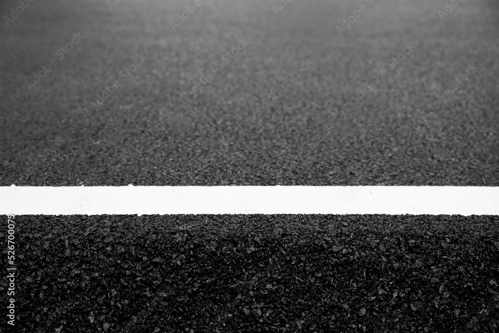 Fototapeta premium abstract picture, asphalt texture with white dashed line.