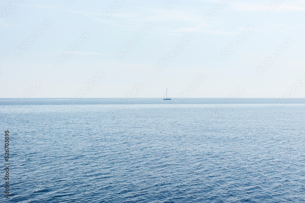Boat on blue sea surface aerial view Boat on blue sea surface aerial view