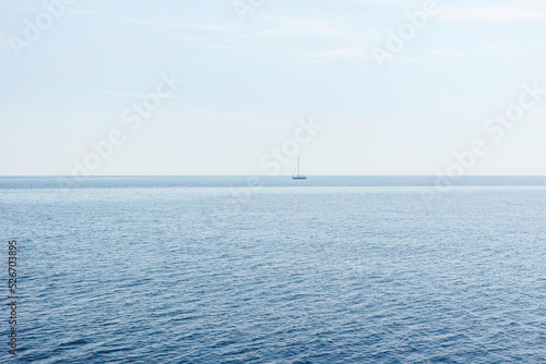 Boat on blue sea surface aerial view © hdesert