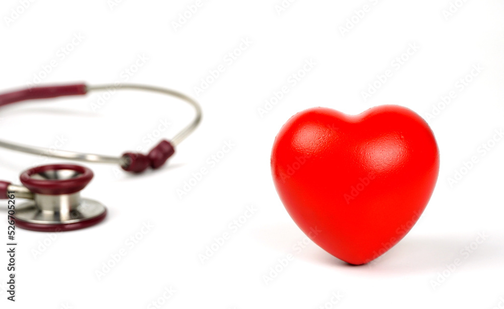 Red heart with stethoscope on white background. Selective focus.Health and Medical concept. Red heart with stethoscope on white background. Selective focus.Health and Medical concept.