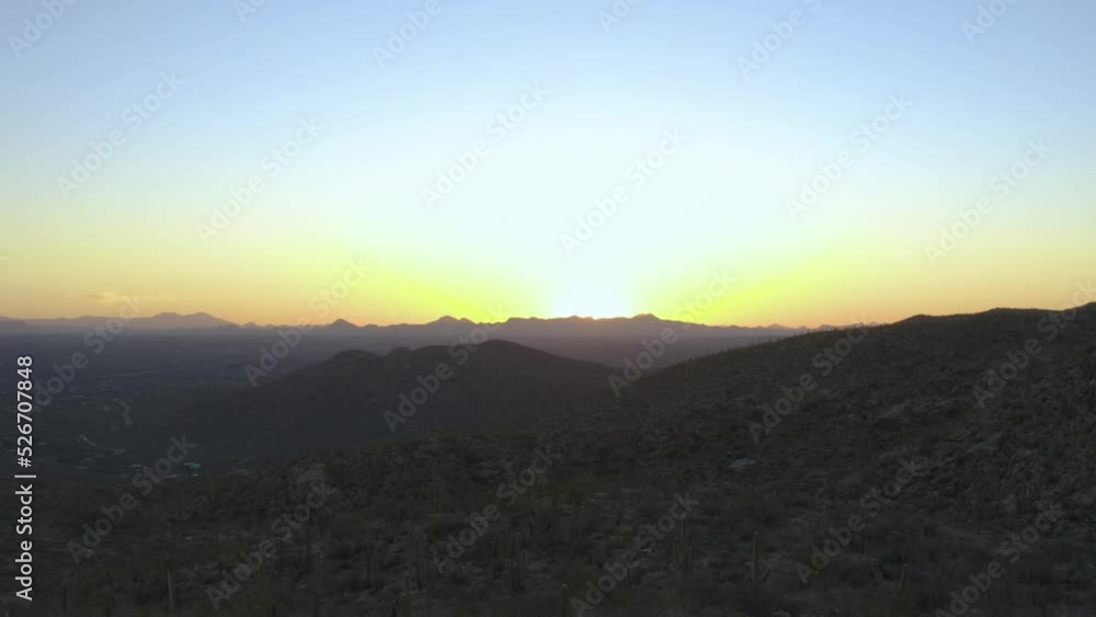 Colorful desert sunset mountain range. Sunburst flair aerial view Sonoran canyon with Saguaro Cactus. Shot on DJI 4k Mavic 2 Pro Tucson, Arizona United States Colorful desert sunset mountain range. Sunburst flair aerial view Sonoran canyon with Saguaro Cactus. Shot on DJI 4k Mavic 2 Pro Tucson, Arizona United States