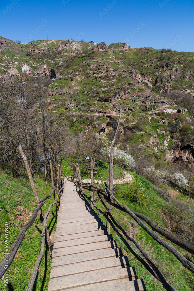 Fototapeta premium Steps to Khndzoresk cave settlement (13th-century, used to be inhabited till the 1950s), Syunik region, Armenia