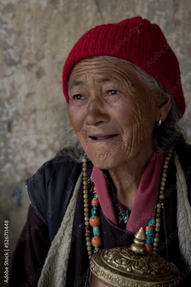 portrait of an old tibetian woman with wrinkles on her face in Tibet | Smiling old woman