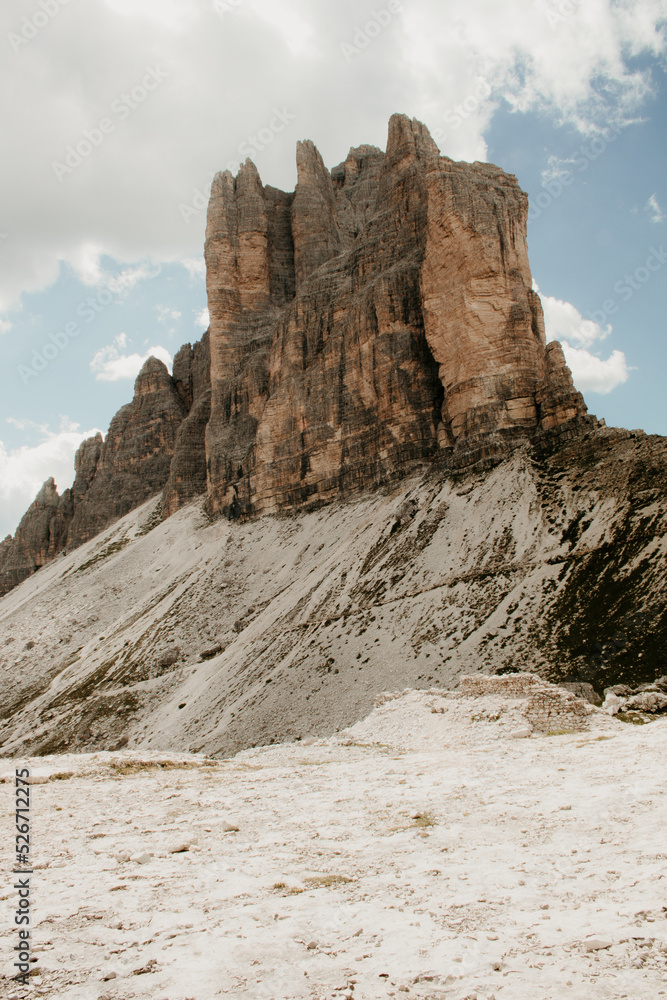 Tre cime di lavaredo in the Alps in Europe. Rock stone landscape in the mountains. Nobody on the image. rocky scenery, blue sky, clouds in the sky. 