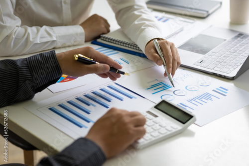 Meeting businessman and financial expert analyzing business report graph and finance budget chart in the office. Concept of finance economy, banking business and stock market research.