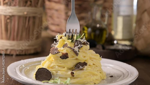  Black truffle on tagliatelle pasta. Expensive lunch, homemade pasta, traditional in the Lazo region of Italy. footage, Pasta on a fork with hot steam