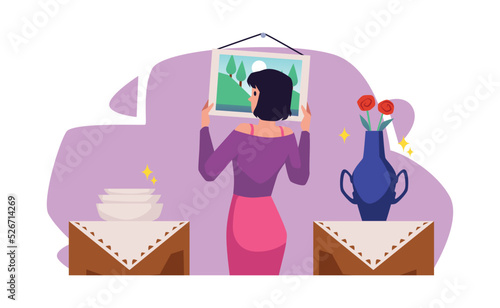 Young woman hangs picture on the wall flat style, vector illustration