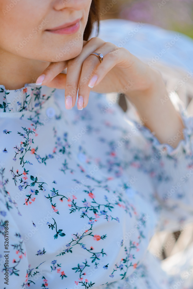 Cropped photo of a woman touching her chin with her hand. Aesthetics and romance Cropped photo of a woman touching her chin with her hand. Aesthetics and romance