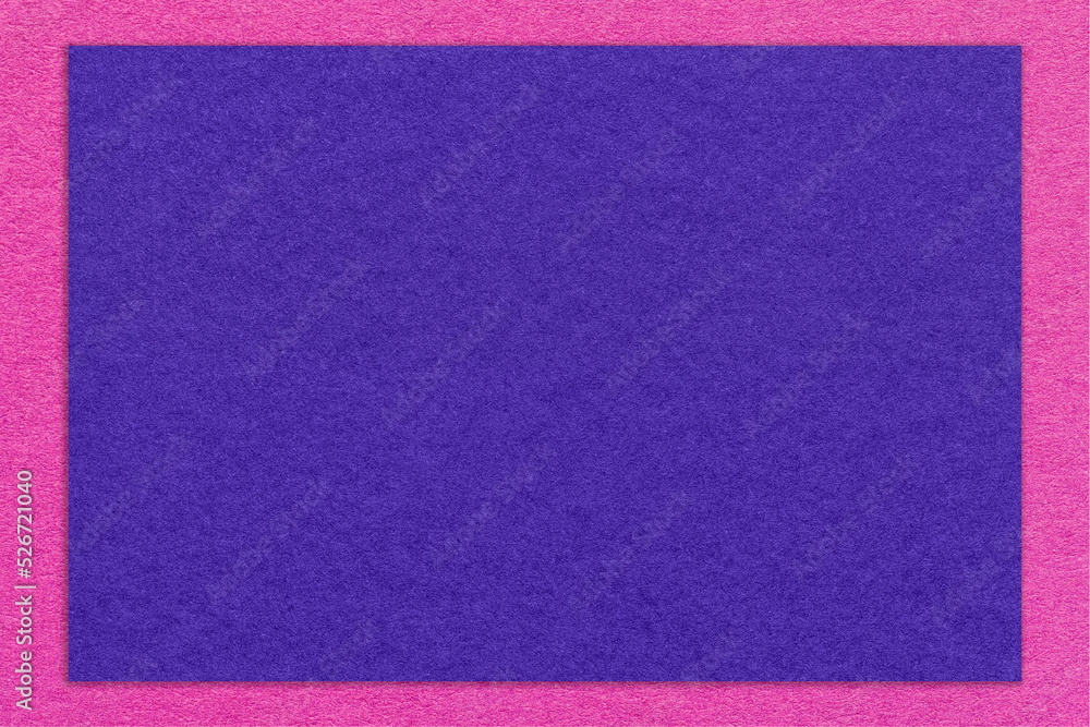 Texture of craft navy blue color paper background with purple border, macro. Vintage dense kraft indigo cardboard Texture of craft navy blue color paper background with purple border, macro. Vintage dense kraft indigo cardboard