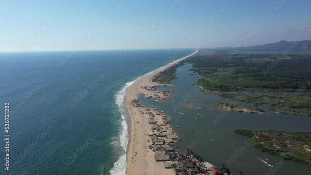 Aerial video of the coast, a Mexican beach in complete calm under the sunset light accompanied by the waves of the sea Aerial video of the coast, a Mexican beach in complete calm under the sunset light accompanied by the waves of the sea