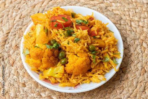 Vegetable pulao recipe made with basmati rice and mix vegetables served in a round plate