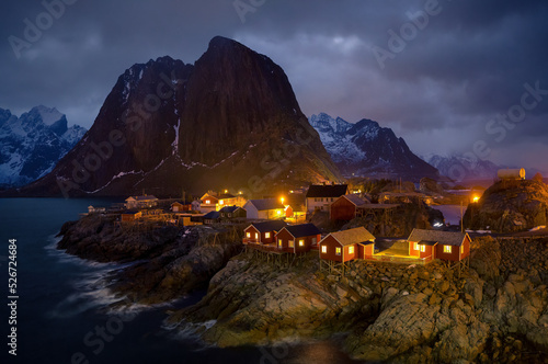 Dramatic Illuminated nightscene of Hamnoy Lofoten island Norway © Peter