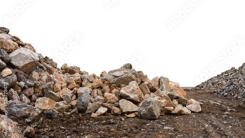 Isolate the granite boulders and small lay heaped on the ground along the road to wait for construction.