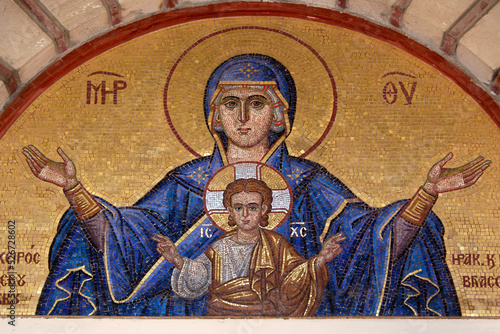 Colourful mosaic hagiography of Mother of God ,on the facade above the entrance of the church of Panagia Giatrissa in Loutraki, Greece