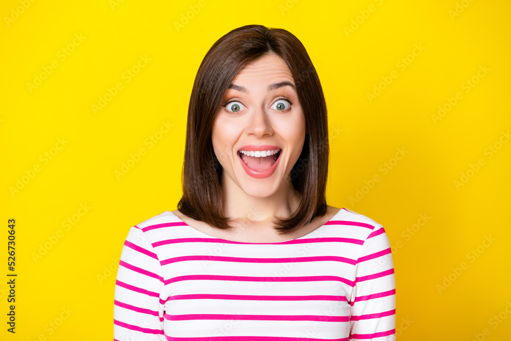 Closeup photo of young attractive beautiful girl looking directly you shocked happy see isolated on yellow color background Closeup photo of young attractive beautiful girl looking directly you shocked happy see isolated on yellow color background