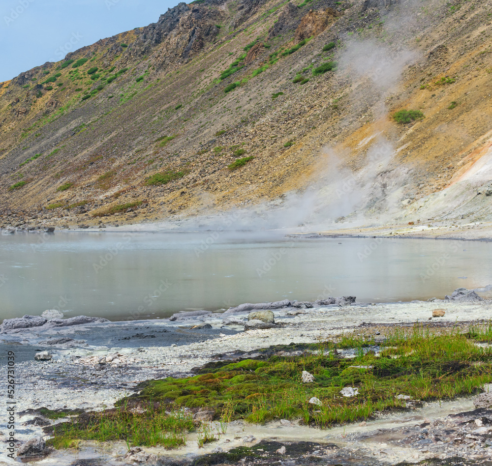 hot mineralized lake with thermal spring and smoking fumaroles in the caldera of the Golovnin volcano on the island of Kunashir hot mineralized lake with thermal spring and smoking fumaroles in the caldera of the Golovnin volcano on the island of Kunashir