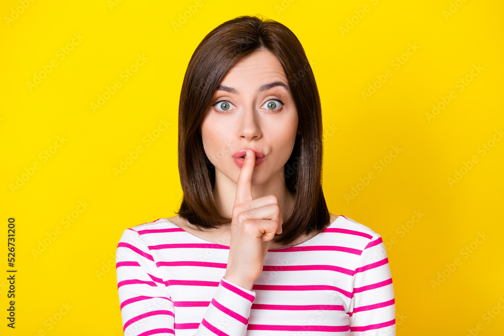 Closeup photo of young attractive funny girl keeping secret isolated on yellow color background Closeup photo of young attractive funny girl keeping secret isolated on yellow color background