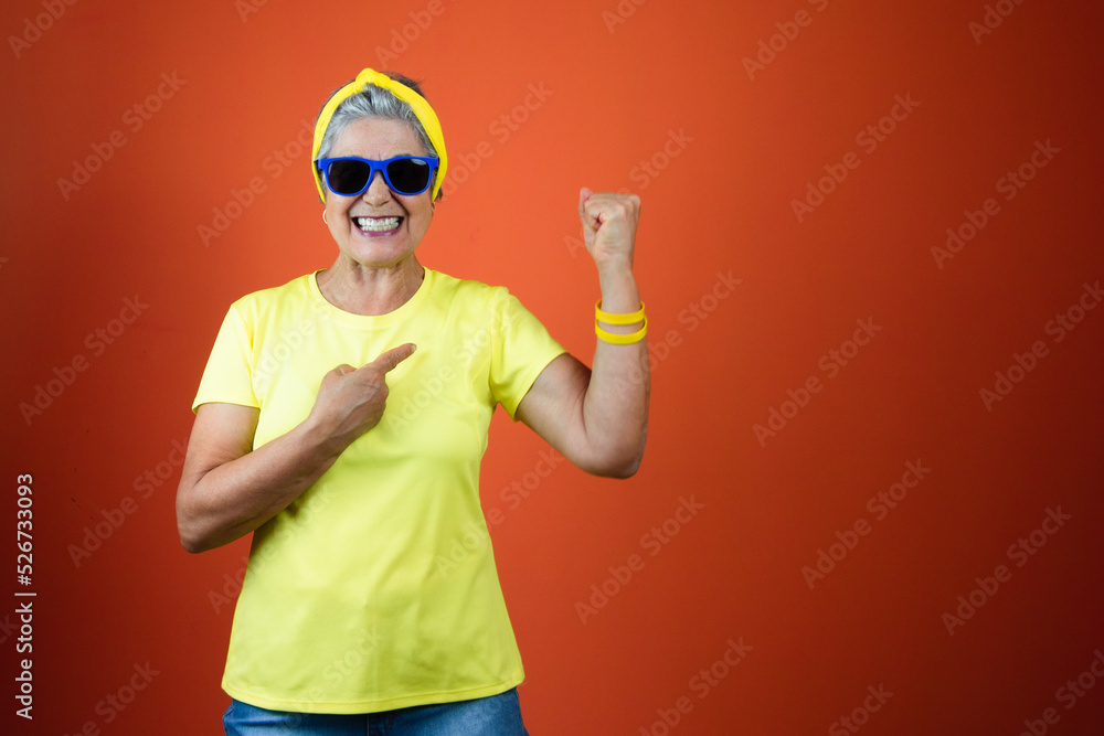  September 7th, Brazil Independence Day - Mature Woman with Gray Hair, yellow shirt isolated