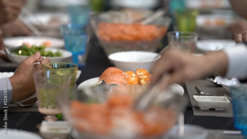 Salaryman is consuming a Japanese course at the high end restaurant, which is served with salmon, sushi, sashimi, and edamame on the large dining table.
Salaryman is consuming a Japanese course at the high end restaurant, which is served with salmon, sushi, sashimi, and edamame on the large dining table.