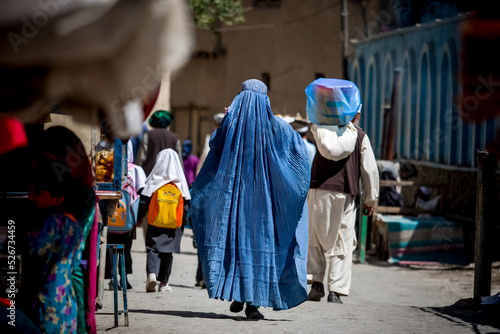 Fototapeta Afghan woman in hijab in Kabul, natives of Afghanistan on streets of the city