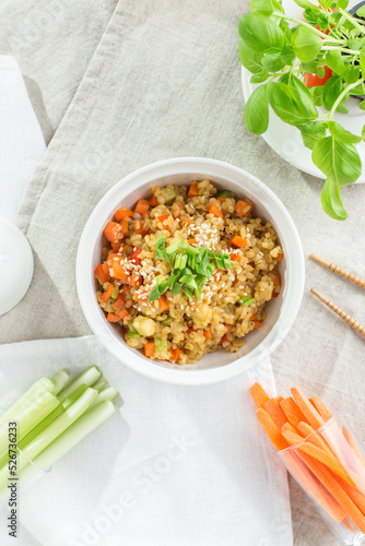mouthwatering Pearl barley with carrot, celery and zucchini on white background