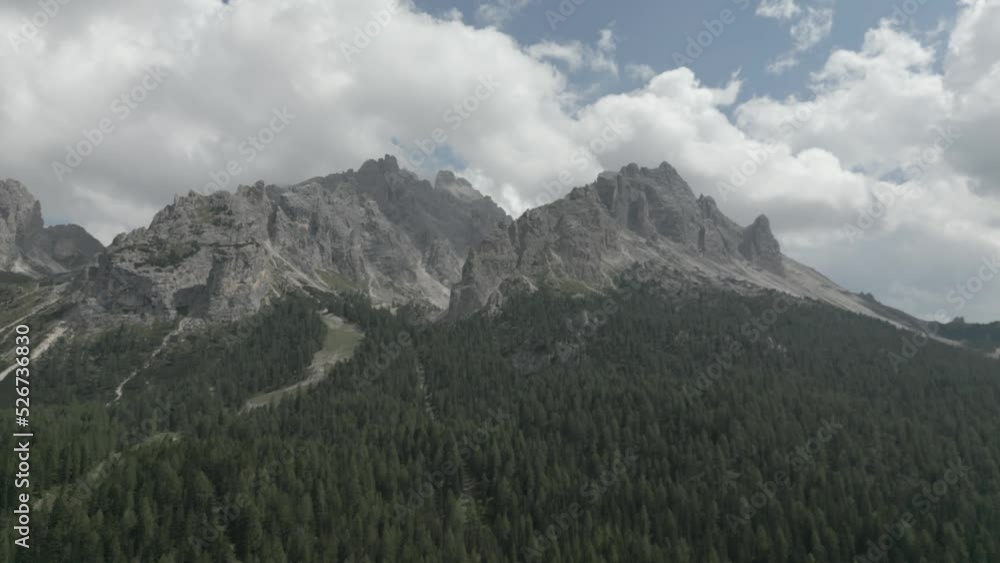 Mountain Crest Aerial Drone with Clouds Video. 4K Mountain Peak Aerial Footage in the Dolomites Italy D-Cinelike Log format Mountain Crest Aerial Drone with Clouds Video. 4K Mountain Peak Aerial Footage in the Dolomites Italy D-Cinelike Log format