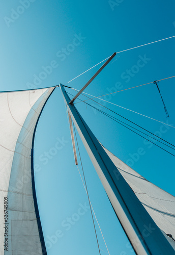 a sail filled with wind. fabric sail. view of the raised sail of the ship