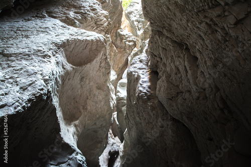 Narrowing rocky sides of a canyon, gorge. photo