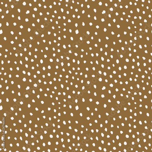 white polka dots pattern at brown backdrop 