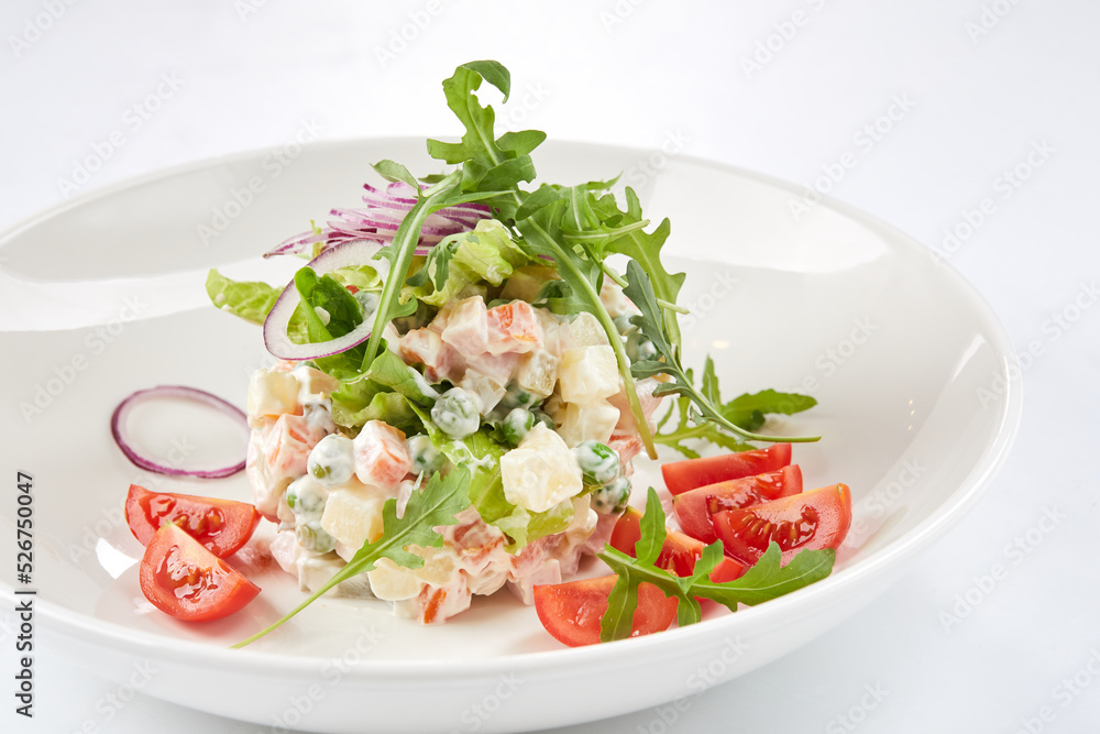 russian salad on the white plate russian salad on the white plate