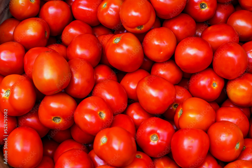 Top view of red tasty fresh tomatos in the market. Top view of red tasty fresh tomatos in the market.