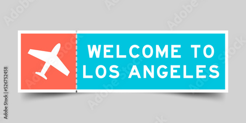 Orange and blue color ticket with plane icon and word welcome to los angeles on gray background