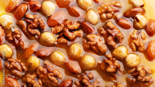 Honeyed assorted nuts organic food background flat view