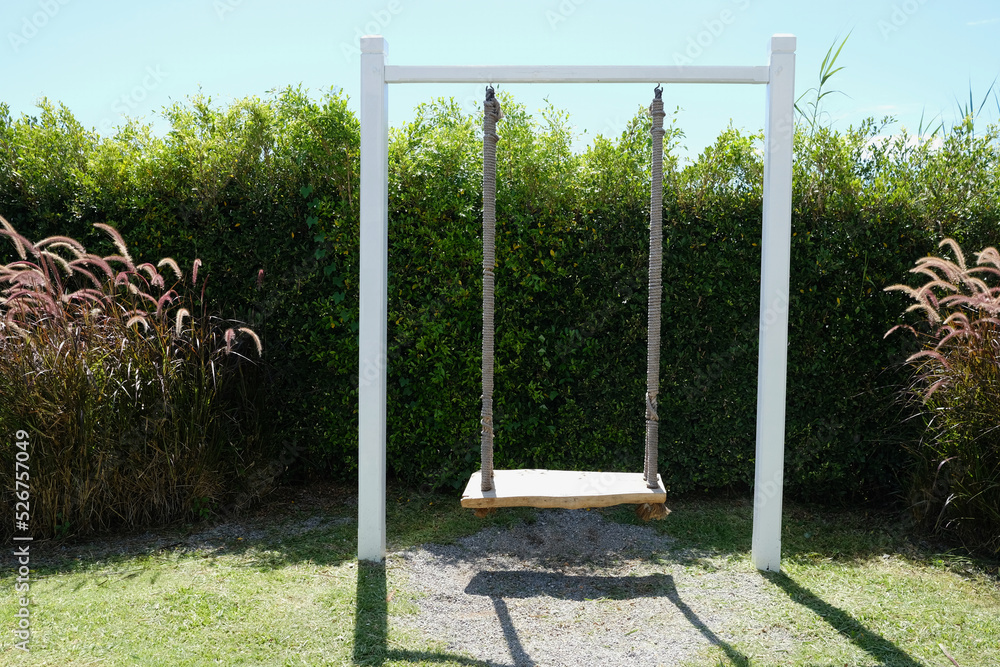 wooden swing in the garden