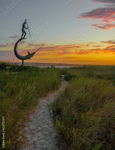 Sculpture of the harpooner during the sunset in the Marthas vineyard photo