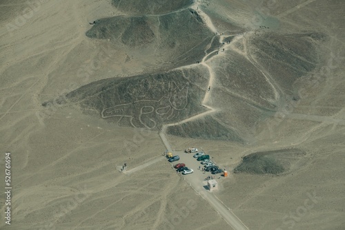 Beautiful shot of cars in Nazca Condor Lines Geoglyphs in the Nasca desert photo