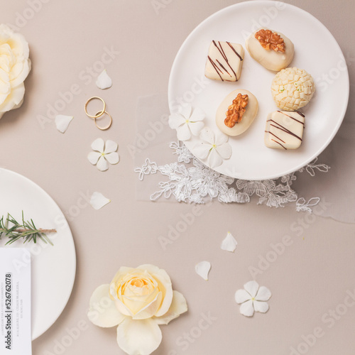Gourmet candies. Spring composition on grey background. Wedding reception concept.