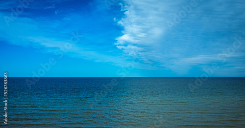 Fototapeta Naklejka Na Ścianę i Meble -  Clouds reflecting in the Baltic Sea against the background of the blue sky