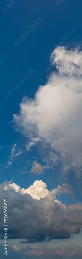 Fantastic thunderclouds at sunrise, vertical panorama Fantastic thunderclouds at sunrise, vertical panorama