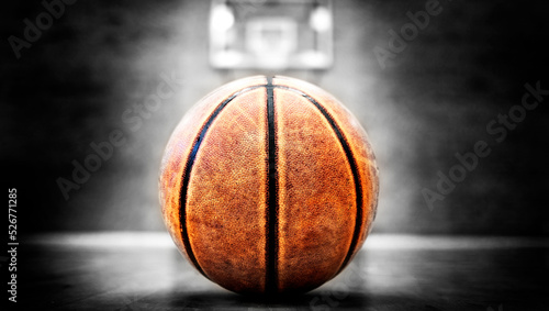 Basketball on Court with Hoops Rim Hardwood Floor Lights © Lane Erickson