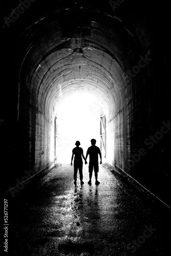 Two People Holding Hands Silhouette at Tunnel Love and Together © Lane Erickson