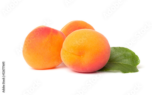 Ripe apricots with leaves isollated on white